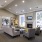 a lounge room with a fireplace and windows