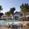 a pool and lounge chairs next to a building