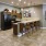 a kitchen with a bar and dining area