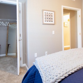 Sleep in style a bedroom with a bed and a closet