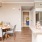 a kitchen with a dining table and chairs next to it