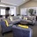 a living room with a couch and chairs